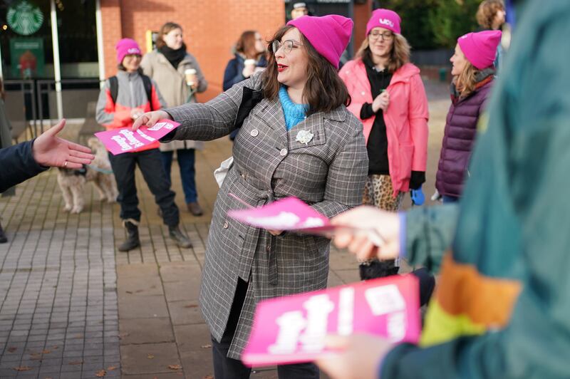 Lecturers hand out leaflets outside the University of Birmingham. PA