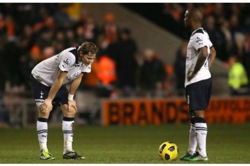 Roman Pavlyuchenko, left, and Jermain Defoe, the Tottenham forwards, look dejected after Blackpool's third goal at Bloomfield Road on Tuesday. Alex Livesey / Getty Images