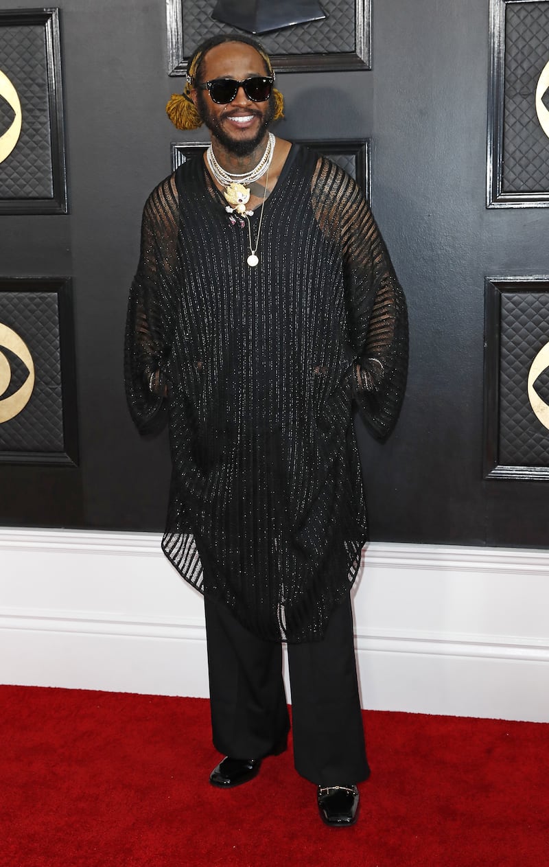 Thundercat arrives in a black embellished tunic. EPA 