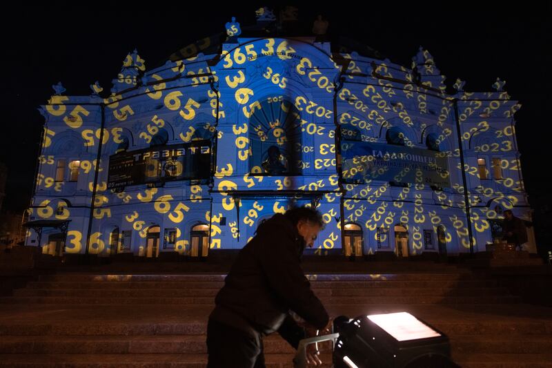 The National Opera of Ukraine building illuminated by Swiss artist Gerry Hofstetter in the colours of the Ukrainian flag, in  Kyiv. Getty