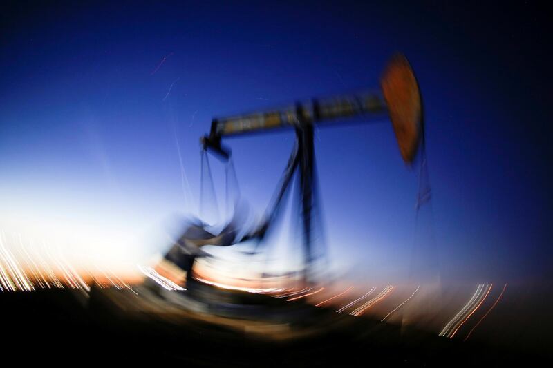 FILE PHOTO: A long exposure image shows the movement of a crude oil pump jack in the Permian Basin in Loving County, Texas, U.S., November 23, 2019. Picture taken November 23, 2019. REUTERS/Angus Mordant/File Photo