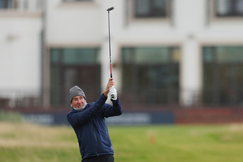 Mike Rutherford, guitarist in the band Genesis, plays a shot on the first hole on day two of the Alfred Dunhill Links Championship. Getty