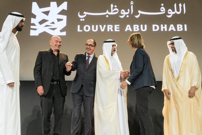 Abu Dhabi, United Arab Emirates, September 6, 2017:    Sheikh Nahyan bin Mubarak Al Nahyan, Minister of Culture, Youth and Community Development shakes hands with Francoise Nyssen French Minister of Culture as Mohamed Khalifa Al Mubarak chairman of Abu Dhabi Tourism & Culture Authority looks on and Jean-Luc Martinez president-director of the Louvre museum, 2nd left, and Jean Novel the architect of Louvre Abu Dhabi react during an event announcing that the Louvre Abu Dhabi will open November 11th, at Manarat Al Saadiyat on Saadiyat Island in Abu Dhabi on September 6, 2017. Christopher Pike / The National

Reporter: Nick Leech
Section: Arts & Culture