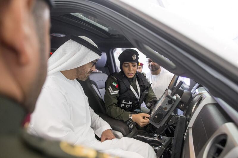 Sheikh Mohammed looks at an Abu Dhabi Police Security Support vehicle. Ryan Carter / Crown Prince Court - Abu Dhabi