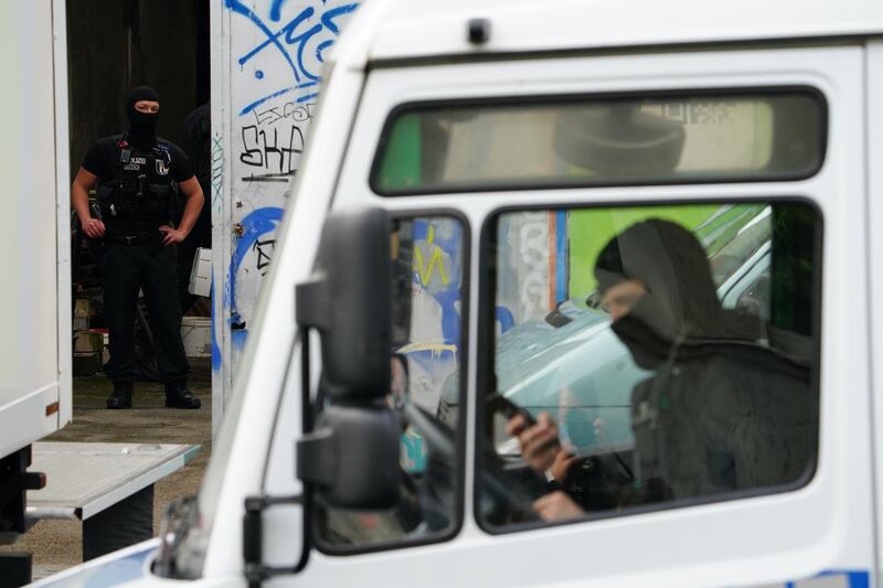 Police officers in the yard of the Al-Irschad association during a raid in Berlin, Germany.  EPA