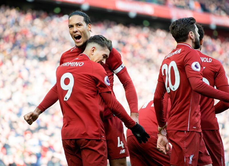 Liverpool's Roberto Firmino, left, celebrates putting Liverpool 2-1 ahead against Burnley. EPA