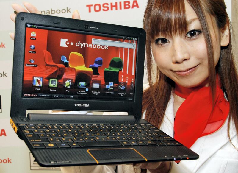 A Toshiba employee unveils the new notebook computer "Dynabook AZ", called a Cludbook PC, equipped with NVIDIA's Tegra 250 processor and a 10.1-inch LCD display, based on the Google's Android OS at a Tokyo hotel on June 21, 2010. The Cludbook will go on sale in August.    AFP PHOTO / Yoshikazu TSUNO (Photo by YOSHIKAZU TSUNO / AFP)