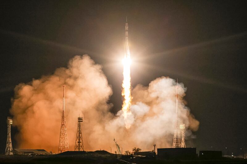 A Soyuz rocket heads to the International Space Station to rescue three astronauts whose spacecraft sprang a leak. AP