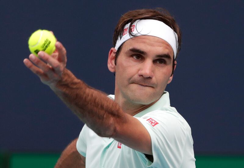 Roger Federer, of Switzerland, serves to Filip Krajinovic, of Serbia, during the Miami Open tennis tournament, Monday, March 25, 2019, in Miami Gardens, Fla. (AP Photo/Lynne Sladky)