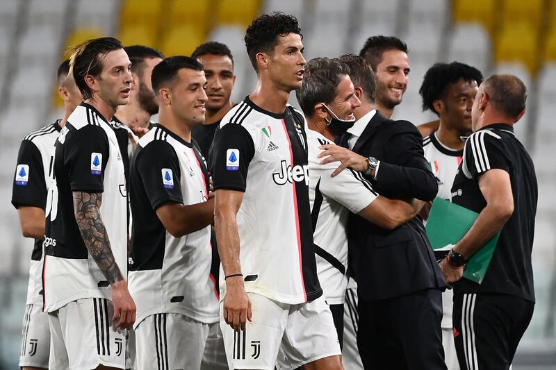 Ronaldo (C) celebrates with his teammates. AFP