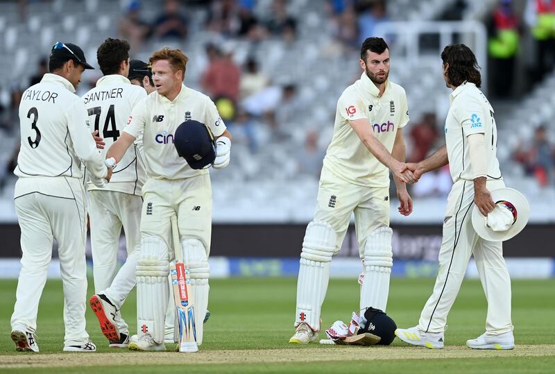 LONDON, ENGLAND - JUNE 06: Ollie Pope and Dom Sibley of England shake hands with Ross Taylor and Colin de Grandhomme of New Zealand after Day 5 of the First LV= Insurance Test Match between England and New Zealand at Lord's Cricket Ground on June 06, 2021 in London, England. (Photo by Gareth Copley/Getty Images)