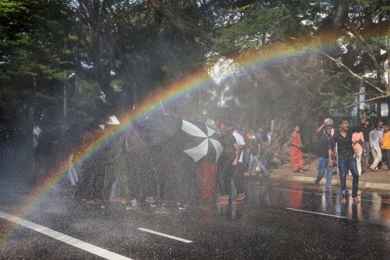 Police use water cannons to disperse university students during a protest demanding changes to the governing system in Colombo, Sri Lanka. Reuters