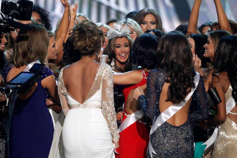 Miss Connecticut Erin Brady (C) is congratulated by other contestants after being crowned during the Miss USA pageant at the Planet Hollywood Resort and Casino in Las Vegas, Nevada June 16, 2013. REUTERS/Steve Marcus (UNITED STATES - Tags: ENTERTAINMENT) FOR EDITORIAL USE ONLY. NOT FOR SALE FOR MARKETING OR ADVERTISING CAMPAIGNS *** Local Caption ***  LAV03_USA-_0617_11.JPG