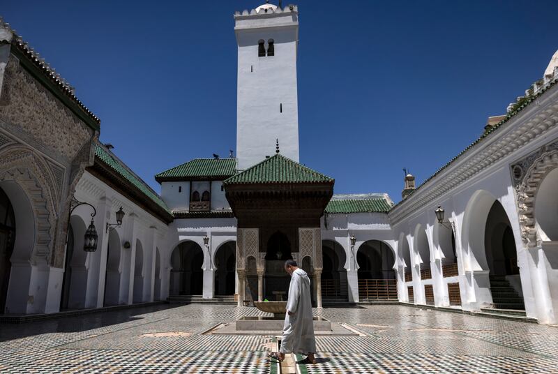 The Qarawiyyin Mosque has a large courtyard surrounded by pillars, separating it from  covered sections set aside for prayer and study.