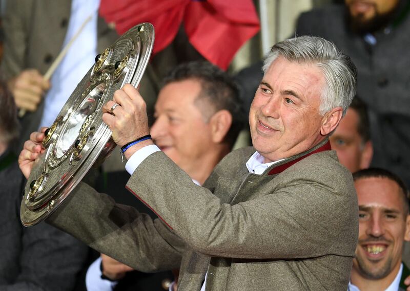 Bayern Munich coach Carlo Ancelotti with Bundesliga title in Munich on May 20, 2017. AFP