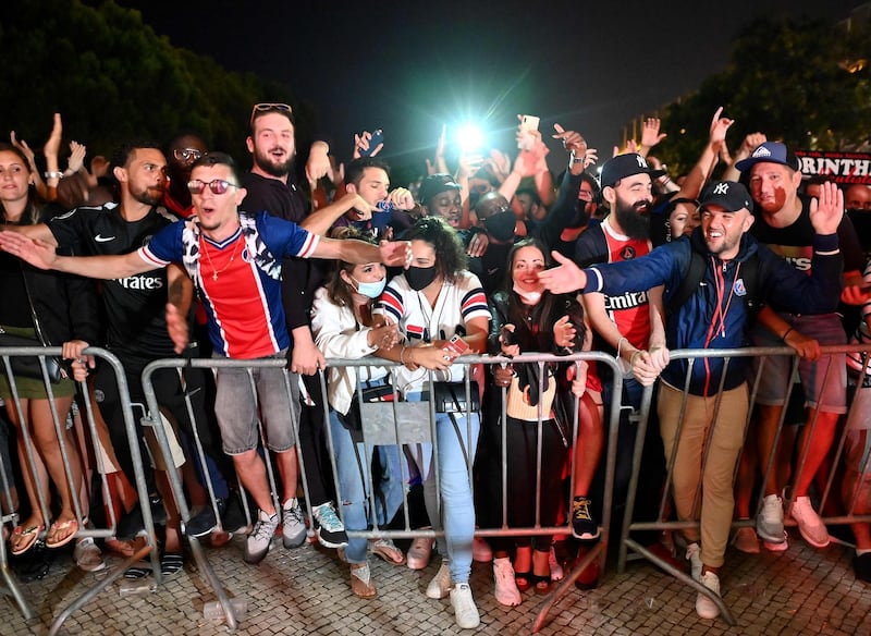 Paris Saint-Germain supporters celebrate outside the team hotel in Lisbon. AFP