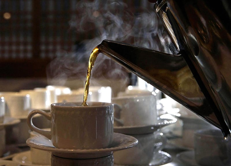 The 'perfect cup of tea' being poured at The Royal Society of Medicine. PA Images via Reuters
