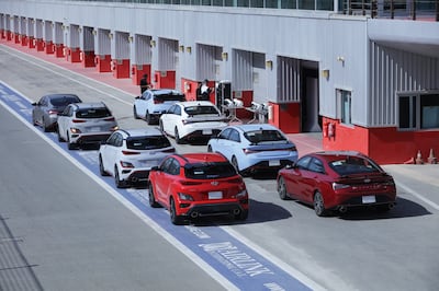 The cars are lined up in the pit lane at Dubai Autodrome. Photo: Hyundai