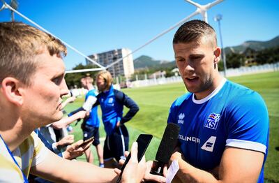 Iceland's midfielder Johann Gudmundsson speaks to the media before a football training session at Olimp Stadium in Kabardinka on June 11, 2018, ahead of the Russia 2018 World Cup.  / AFP / Jonathan NACKSTRAND
