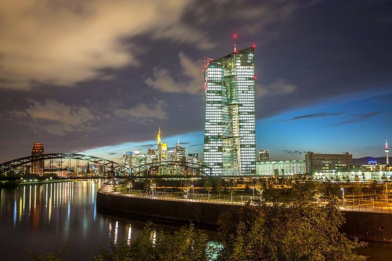 The new building of the European Central Bank is illuminated while dominating the skyline of Frankfurt. Frank Rumpenhorst / EPA