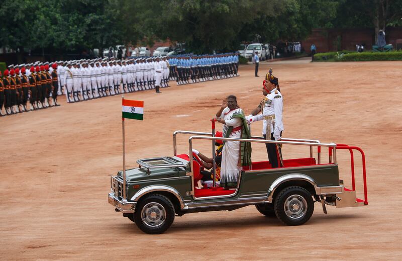 Ms Murmu, 64, inspects a guard of honour after she was sworn in New Delhi. AP