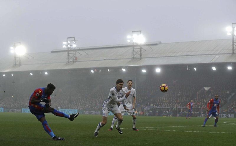 Crystal Palace’s Wilfried Zaha, left, crosses the ball during the match. Matt Dunham / AP Photo