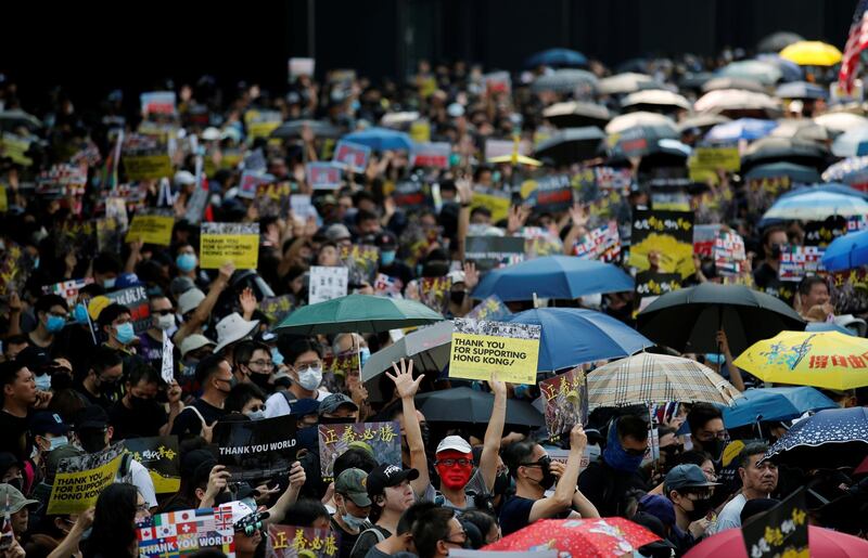 Anti-government protesters gather at the start of a protest march in Hong Kong's tourism district of Tsim Sha Tsui, China. Reuters