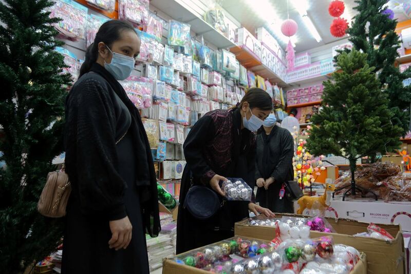 People buy decorations from a shop selling various items for Christmas celebrations, after the government eased restrictions on the sale of Christmas ornaments and decorations, in Riyadh, Saudi Arabia. Reuters