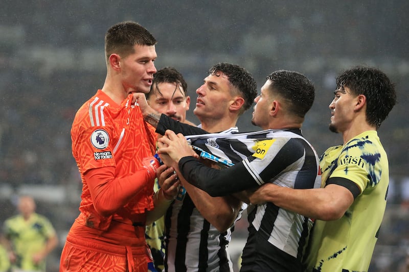 Leeds goalkeeper Illan Meslier clashes with Newcastle's Brazilian midfielder Bruno Guimaraes late in the game. AFP