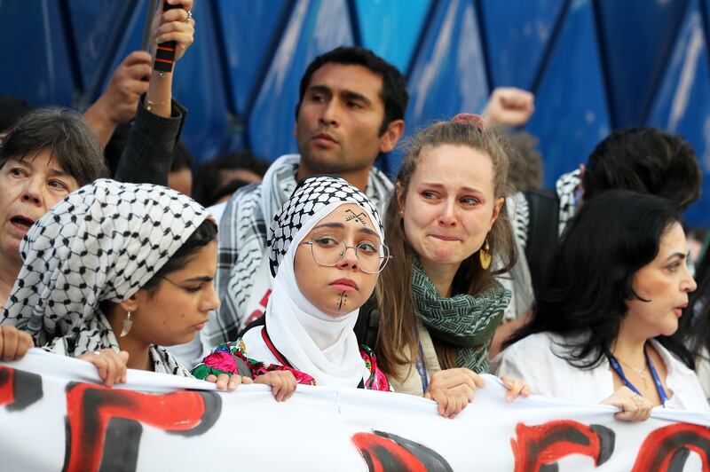 Cop28 demonstrators call for a ceasefire in Gaza. Pawan Singh / The National