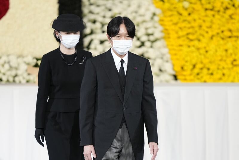 Japan's Crown Prince Akishino, right, and Crown Princess Kiko pay their respects during Abe's final farewell. EPA