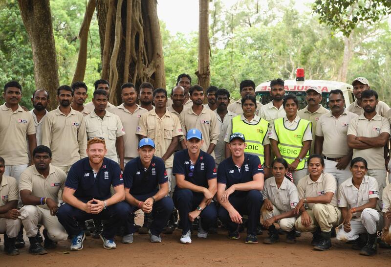 England players, left to right, Jonny Bairstow, Joe Root, Olly Stone and Keaton Jennings fitted out with de-mining personal protective equipment pictured with members of MAG after their tour. Getty Images