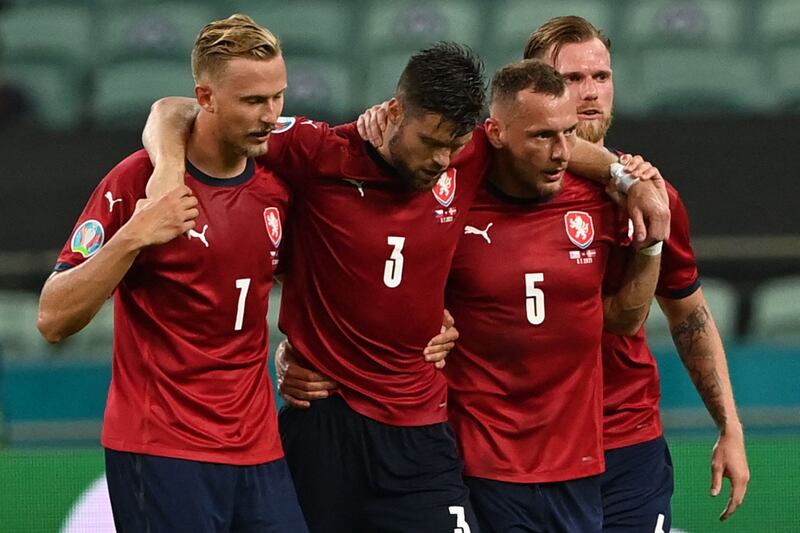 Czech Republic's defender Ondrej Celustka is helped by teammates after an injury.