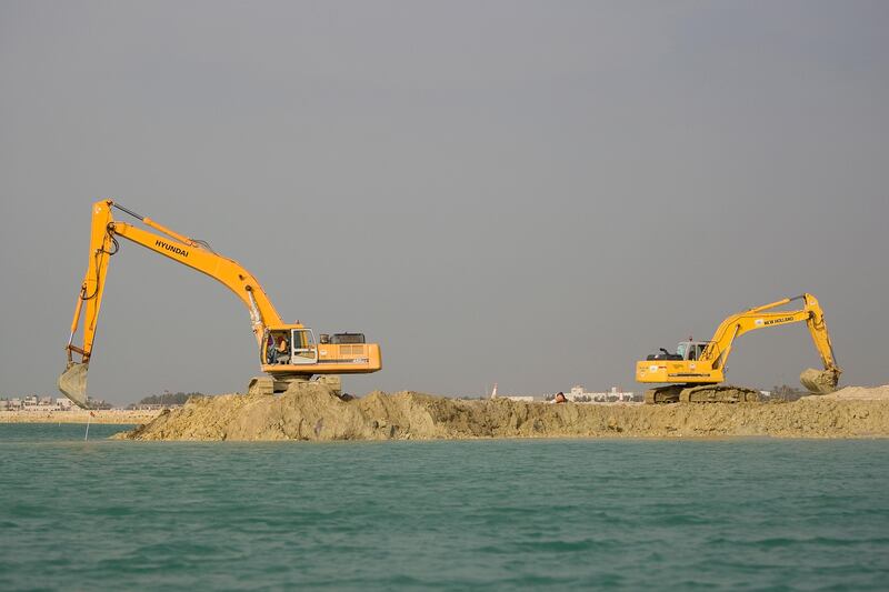 Diraz, Bahrain - April 14, 2008 - Excavators dig into the sand, as part of the reclaimation of the coastline in Diraz. ( Philip Cheung / The National )? *** Local Caption *** PC024-Bahrainfishing.jpg
