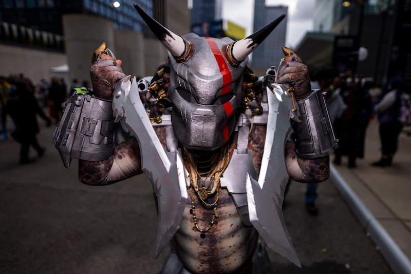 A Predator cosplayer during the New York Comic Con. Charles Sykes / Invision / AP