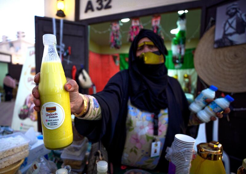 Abu Dhabi, United Arab Emirates, January 10, 2021.  A saleslady with some  Yadooh drinks at the Arabic market at Sheikh Zayed Festival.
Victor Besa/The National
Section:  NA
Reporter:  Saeed Saeed