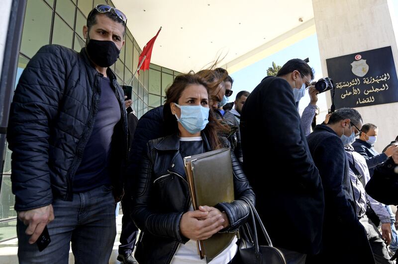 Staff stand outside the closed headquarters of Tunisia's Supreme Judicial Council in Tunis on February 7. AFP
