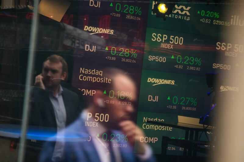 Monitors display stock market information as pedestrians are reflected in a window at the Nasdaq MarketSite in the Times Square area of New York, U.S., on Friday, Sept. 6, 2019. U.S. stocks advanced and Treasuries were mixed as Federal Reserve Chairman Jerome Powell’s latest comments did little to alter views on Federal Reserve policy. Photographer: Michael Nagle/Bloomberg