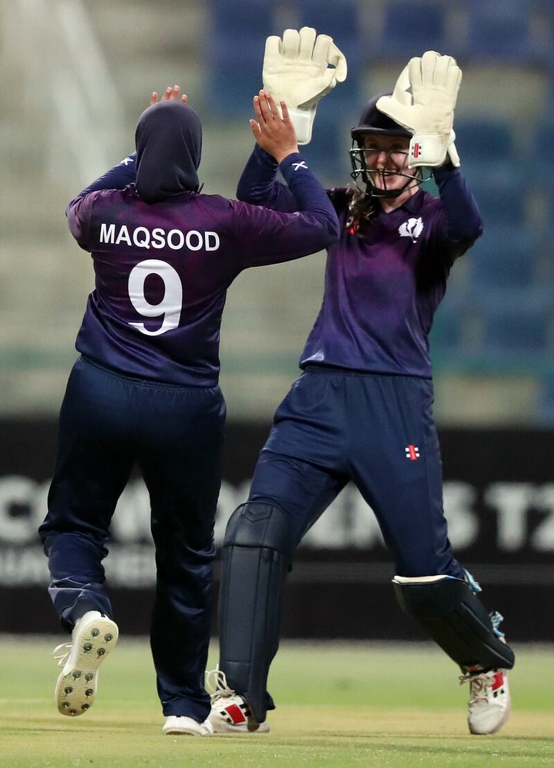 Scotland's Abtaha Maqsood celebrates after taking the wicket of Sri Lanka's Kavisha Dilhari, stumped by Scotland's Sarah Bryce, right. 