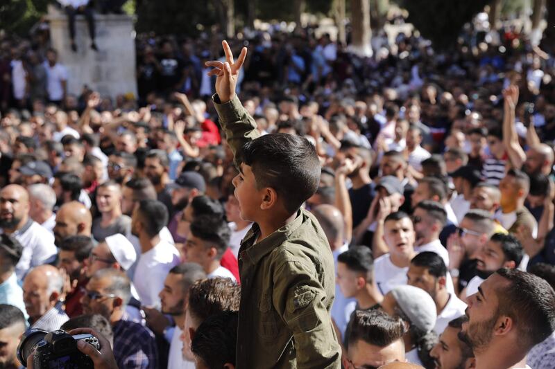 Palestinian Muslims shout anti-occupation slogans as Israeli security forces enter the Al Aqsa Mosque compound. AFP