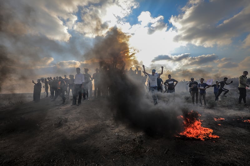 Palestinians protest near the border between Israel and the Gaza Strip. More than 40 Palestinians and one Israeli soldier were injured during clashes. EPA