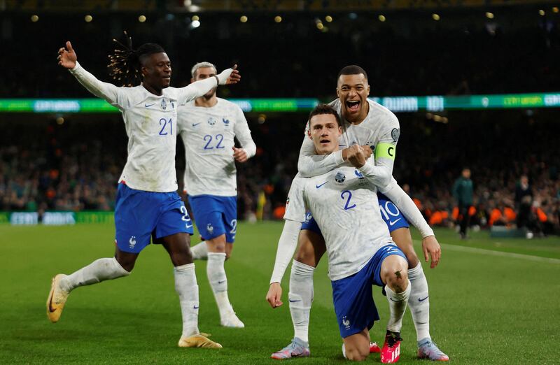 France's Benjamin Pavard celebrates with Kylian Mbappe, Eduardo Camavinga and Theo Hernandez after scoring against the Republic of Ireland in their Euro 2024 qualifiers at the Aviva Stadium in Dublin. Reuters