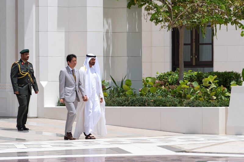 ABU DHABI, UNITED ARAB EMIRATES - April 30, 2018: HH Sheikh Mohamed bin Zayed Al Nahyan, Crown Prince of Abu Dhabi and Deputy Supreme Commander of the UAE Armed Forces (R), receives HE Shinzo Abe, Prime Minister of Japan (2nd R), during a reception at the Presidential Palace.

( Hamad Al Mansouri for Crown Prince Court - Abu Dhabi )