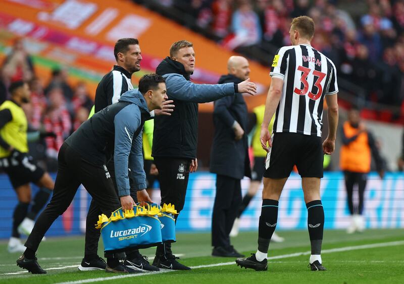 Newcastle United manager Eddie Howe talks to Dan Burn. Reuters