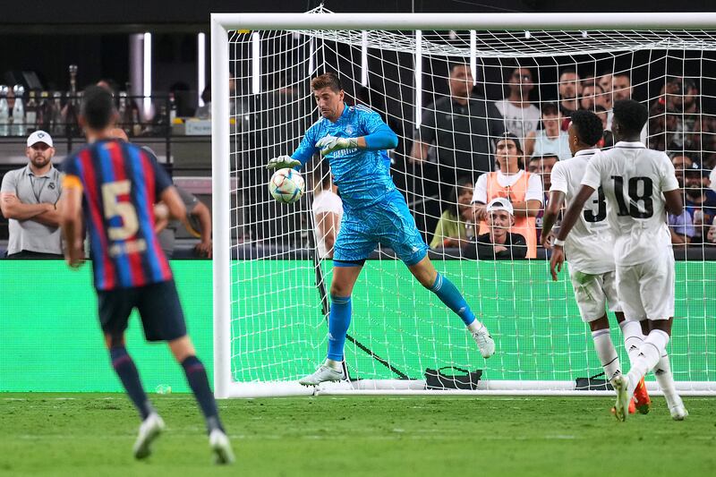 Real Madrid goalkeeper Thibaut Courtois makes a save against Barcelona. USA Today