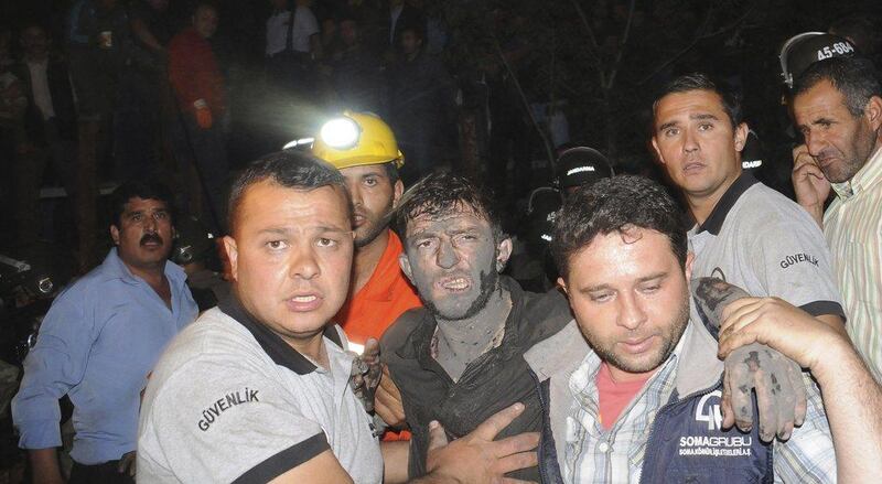 An injured miner is carried to an ambulance in Soma. Depo Photos / Reuters