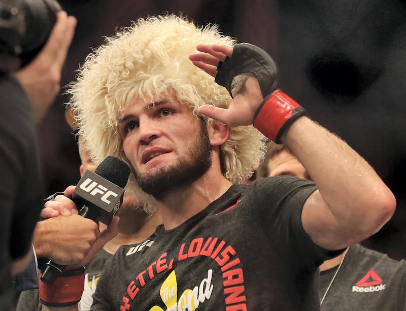 Abu Dhabi, United Arab Emirates - September 07, 2019: Lightweight title bout between Khabib Nurmagomedov (black shorts, winner) and Dustin Poirier in the main event at UFC 242. Saturday the 7th of September 2019. Yas Island, Abu Dhabi. Chris Whiteoak / The National