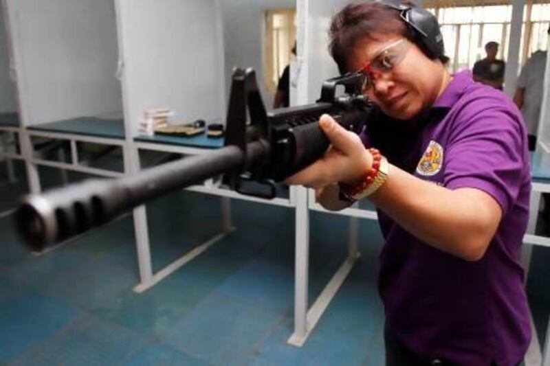 The Philippines' chief tax collector is constantly thinking about targets. Sometimes she picks up an assault rifle and hits them.