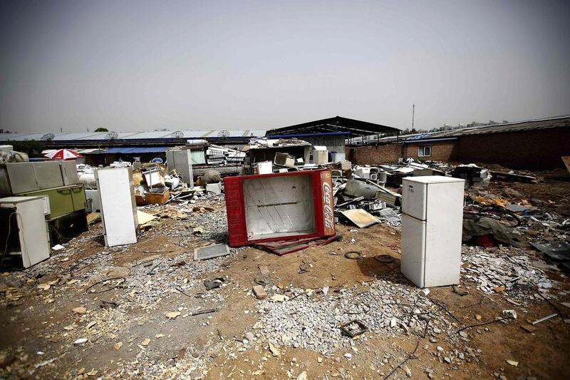 Broken fridges are seen in the yard of a recycling workers’ tenement house in Dongxiaokou village. Kim Kyung-Hoon / Reuters