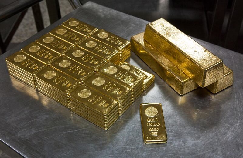 September 27, 2011 - Approximately 100 kilograms of gold is seen at the Emirates Gold refinery in Dubai, UAE. The 1 millionth 1 kilogram gold bar made is also seen at the bottom centre. Pawel Dwulit / The National